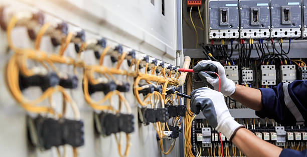 Professional Electrician technician working in Highland Park, TX